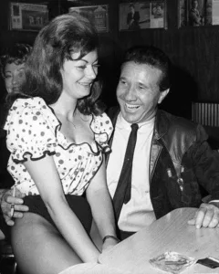 White Sport Coat, Pink Carnation — Marty Robbins’ Bittersweet Prom Night Featured image