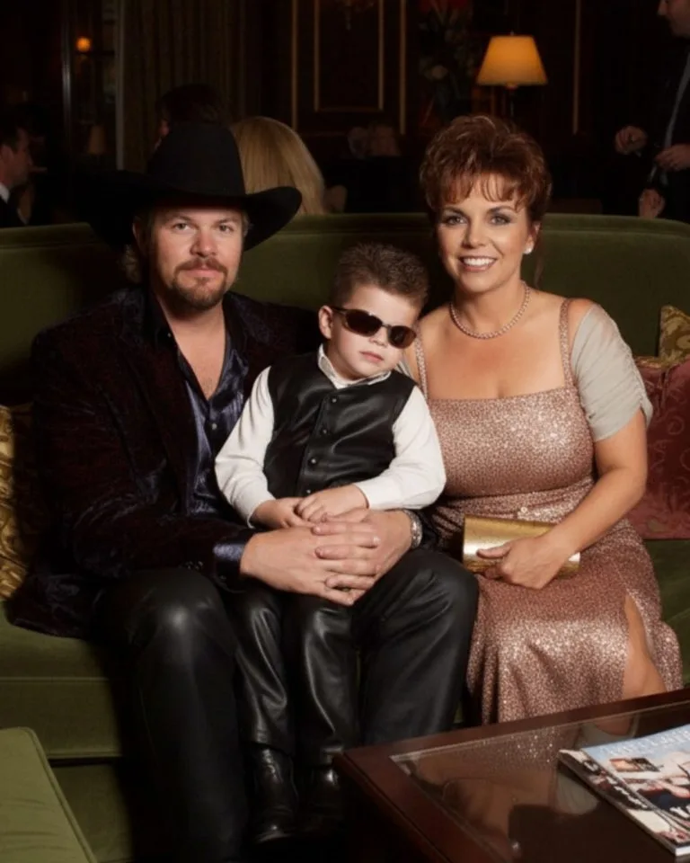The restaurant buzzed with conversation and the clink of silverware, but over at a quiet corner table, Toby Keith wasn’t the center of attention. He was simply a husband, a dad — a man soaking in the kind of pride no amount of fame could buy. Tricia chuckled at a joke from the waiter, while their little boy — cowboy boots on, oversized sunglasses slipping down his nose — tried to mimic his dad’s serious expression. Toby glanced over, grinned, and shook his head. “Looks like I’ve got some competition,” he said with a soft laugh. It was an ordinary, easily overlooked moment — the kind that never makes the news — but if you’d noticed, you’d have seen what fuels every one of his songs: not the spotlight, not the show, but something far more lasting — love, quiet and unwavering. Featured image