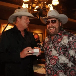 “I grew up on Hank Jr., Waylon, and Merle. They taught me you could sing real — sing like yourself.” There’s a quiet moment from the 1990s that few fans ever forget — when Alan Jackson, standing under the CMA lights, spoke the kind of truth you can’t rehearse. He looked out at the crowd and said, “I grew up on Hank Jr., Waylon, and Merle. They taught me you could sing real — sing like yourself.” It wasn’t flattery. It was confession. Before the hits, before the awards, before the polished stages — there was a young man in Georgia tuning his guitar to Hank Jr.’s voice on the radio. That outlaw spirit — loud, stubborn, and honest — shaped everything Alan ever became. Many call Alan Jackson a legend. But when he talks about Hank Jr., his voice softens. Like a student remembering the man who showed him how to stand tall, even when Nashville told him to bend. “Some men follow rules,” Alan once said quietly, “and some write their own songs.” And somewhere down a lonely highway, he still hums those words that saved a thousand broken souls: “I’m just a singer… a simple man doing the best I can.” Featured image