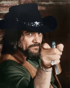 “I DON’T WANT TO LIVE LIKE THIS ANYMORE.” At a time when America saw Waylon Jennings as an untouchable Outlaw legend, few knew he was quietly losing himself to addiction. The long tours, the noise, the pressure to stay “strong” for everyone — it all wore him down. Some nights he looked in the mirror and didn’t recognize the man staring back. He wasn’t the Texas kid playing guitar to help his mother anymore. He wasn’t the fearless cowboy onstage. He was just a tired man trying to breathe under the weight of his own fame. Then in 1984, after a painful turning point and Jessi Colter’s desperate plea, Waylon said one simple line — “I DON’T WANT TO LIVE LIKE THIS ANYMORE.” And he meant it. When he walked back into the studio, Nashville went silent. His voice was steadier. His eyes brighter. He looked like a man who had stepped out of the fire carrying his scars… but standing taller than ever. 💔 Featured image