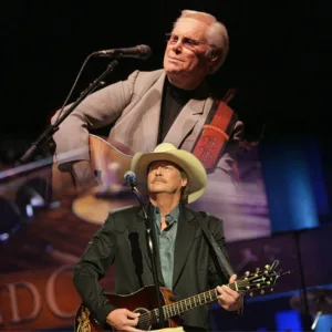 “ONE FUNERAL. ONE OPRY STAGE. ONE SONG THE WORLD WILL NEVER FORGET.”When George Jones passed away, his family brought him home to the Opry House — the place that held his voice for more than half a lifetime. On May 2, 2013, the room was packed, but it felt strangely quiet, like everyone was breathing the same heavy moment. Then Alan Jackson stepped onto the old wooden circle where George once stood. No lights, no big speeches… just a man holding a song. When he began “He Stopped Loving Her Today,” something shifted. You could see people wiping their faces, trying not to sob. It felt like George was right there, taking one last bow. ❤️ Featured image