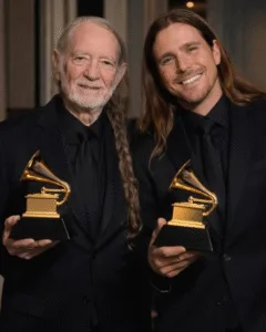 THE 2026 GRAMMY NOD THAT HIT DIFFERENT — FATHER AND SON. Congratulations to Willie Nelson and his son Lukas on their 2026 Grammy nominations for Best Traditional Country Album. It’s the kind of news that makes you pause. Not because of the trophy. But because of the quiet look behind it. Willie doesn’t rush anything. He never has. Lukas stands beside him, steady, listening more than he speaks. Same room. Same songs. Different seasons of the same life. You can almost see it—the soft stage lights, a small nod, the way a father lets a son lead without stepping away. This isn’t about winning. It’s about sharing the road, mile by mile, and knowing the music will keep going.