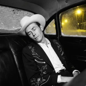 The Day the Music Died: Hank Williams' Final Ride and Legacy The Day the Music Died: A New Year’s Tragedy. On New Year’s Day, 1953, the world lost a legend in the back seat of a Cadillac. Hank Williams, only 29 years old, left behind a legacy that changed country music forever. With 35 Top 10 Billboard hits—including timeless classics like “Cold, Cold Heart” and “Hey, Good Lookin'”—his success was undeniable. Yet, a haunting shadow hangs over his untimely passing. In a twist of dark irony, his last single released during his lifetime was titled “I’ll Never Get Out of This World Alive.” Was it a premonition? The events leading up to that lonely highway drive are as heartbreaking as “Your Cheatin’ Heart.”
