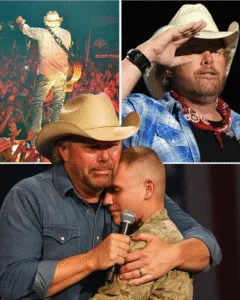AMERICA DIDN’T CHEER. AMERICA HELD ITS BREATH. The music was loud. Then it stopped. Not by accident. By choice.
Under the lights, a young veteran appeared. Prosthetic legs. Steady steps. Eyes forward. You could feel the air change.
Toby Keith didn’t rush. He waited. When they met, there were no words at first. Just an embrace. A long one. His voice cracked when he sang again.
Earlier that year, he’d stood alone, singing about time, illness, and fear. But this night was heavier. This was about sacrifice. And gratitude. For a few quiet seconds, no one was a stranger. Just people… remembering why some moments matter. Featured image