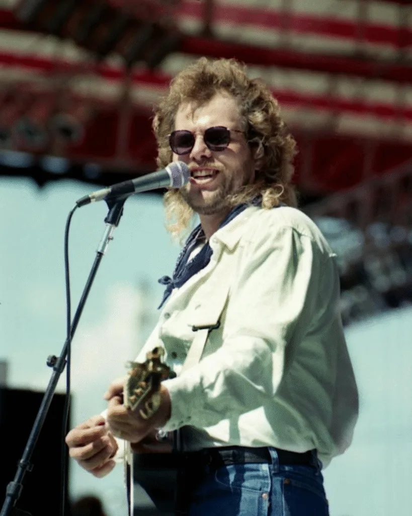 THEY TOLD HIM TO SIT DOWN AND SHUT UP. HE STOOD UP AND SANG LOUDER. He wasn’t your typical polished Nashville star with a perfect smile. He was a former oil rig worker. A semi-pro football player. A man who knew the smell of crude oil and the taste of dust better than he knew a red carpet. When the towers fell on 9/11, while the rest of the world was in shock, Toby Keith got angry. He poured that rage onto paper in 20 minutes. He wrote a battle cry, not a lullaby. But the “gatekeepers” hated it. They called it too violent. Too aggressive. A famous news anchor even banned him from a national 4th of July special because his lyrics were “too strong” for polite society. They wanted him to tone it down. They wanted him to apologize for his anger. Toby looked them dead in the eye and said: “No.” He didn’t write it for the critics in their ivory towers. He wrote it for his father, a veteran who lost an eye serving his country. He wrote it for the boys and girls shipping out to foreign sands. When he unleashed “Courtesy of the Red, White and Blue,” it didn’t just top the charts—it exploded. It became the anthem of a wounded nation. The more the industry tried to silence him, the louder the people sang along. He spent his career being the “Big Dog Daddy,” the man who refused to back down. In a world of carefully curated public images, he was a sledgehammer of truth. He played for the troops in the most dangerous war zones when others were too scared to go. He left this world too soon, but he left us with one final lesson: Never apologize for who you are, and never, ever apologize for loving your country.