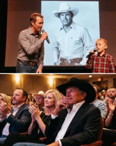 “WHEN A 73-YEAR-OLD LEGEND SAT SILENT… AND LET HIS BLOODLINE SING HIS LIFE BACK TO HIM.” Last night didn’t feel like a concert. It felt like a living room with 20,000 people holding their breath. Bubba Strait walked out first. Calm. Steady. Then little Harvey followed — small boots, big nerves. The opening chords of “I Cross My Heart” drifted through the arena. George Strait didn’t sing. He sat there. 73 years of highways, heartbreak, rodeos, and sold-out nights — and this time, he just listened. A son who knows the stories. A grandson who only knows the legend. No fireworks. No long speech. Just a family handing a man his own memories — one verse at a time. There was a pause near the end. George looked down. Smiled once. That quiet kind of smile that says everything. Some songs become classics. Others become inheritance. And for a few minutes… country music felt smaller. Softer. Personal.