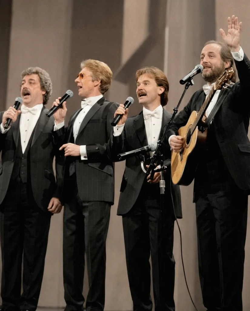 “THE FINAL ‘THANK YOU’ THAT MADE THOUSANDS CRY IN THE SAME MINUTE.” That night in Virginia didn’t feel like a concert. It felt like a held breath. Thirty-eight years of harmony sat quietly in the room as The Statler Brothers walked out one last time—slower, steadier, eyes shining with the kind of knowing that needs no speech. Before a single note, you could already see it: hands to faces, heads bowed, people bracing for something they weren’t ready to lose. Some had been there since Flowers on the Wall. Others grew up on Elizabeth. But when the opening line of Thank You World drifted out, time softened. The crowd didn’t just listen—they stood, almost without thinking, as if standing was a promise: we’ll remember. There were no fireworks. No big goodbye speech. Just four voices offering gratitude instead of grief. And in that shared minute—when thousands wiped their eyes at once—it wasn’t only their farewell. It was the quiet closing of an era that knew how to say goodbye with grace. When a song becomes a goodbye, are we mourning the artists on stage — or the part of our own lives that’s quietly ending with them? “THE FINAL ‘THANK YOU’ THAT MADE THOUSANDS CRY IN THE SAME MINUTE.” That night in Virginia didn’t feel like a concert. It felt like a held breath. Thirty-eight years of harmony sat quietly in the room as The Statler Brothers walked out one last time—slower, steadier, eyes shining with the kind of knowing that needs no speech. Before a single note, you could already see it: hands to faces, heads bowed, people bracing for something they weren’t ready to lose. Some had been there since Flowers on the Wall. Others grew up on Elizabeth. But when the opening line of Thank You World drifted out, time softened. The crowd didn’t just listen—they stood, almost without thinking, as if standing was a promise: we’ll remember. There were no fireworks. No big goodbye speech. Just four voices offering gratitude instead of grief. And in that shared minute—when thousands wiped their eyes at once—it wasn’t only their farewell. It was the quiet closing of an era that knew how to say goodbye with grace. When a song becomes a goodbye, are we mourning the artists on stage — or the part of our own lives that’s quietly ending with them?